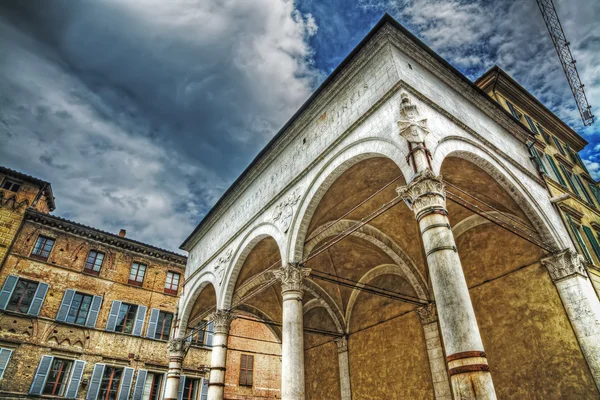 Loggia del Papa under a grey sky with clouds in Siena — Stock Photo, Image