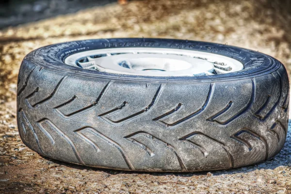 Car wheel on the ground — Stock Photo, Image