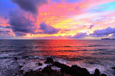 pink sky with clouds over Alghero coast