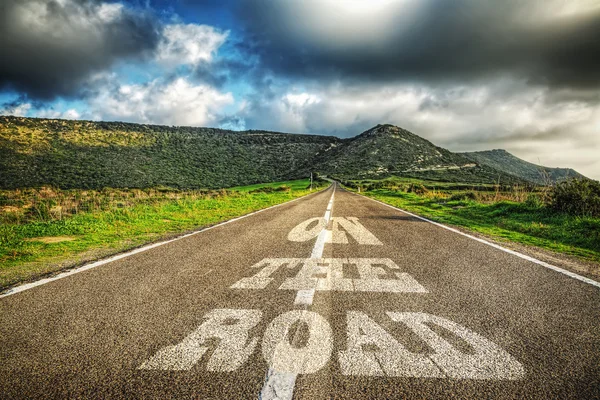 On the road written on the asphalt — Stock Photo, Image