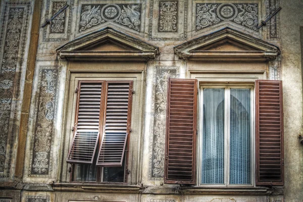 Windows in a painted wall in Florence — Stock Photo, Image