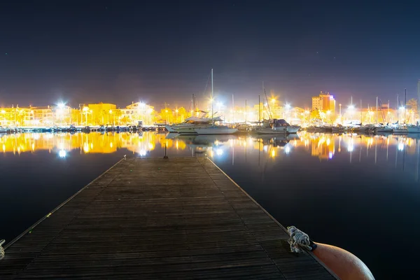 Wooden pier in Alghero harbor — Stock Photo, Image