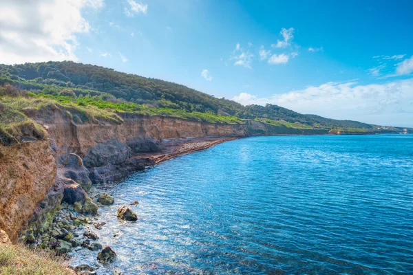 Wolken boven Castelsardo oever — Stockfoto