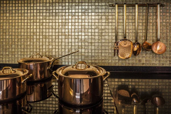 Golden luxury kitchen cookware — Stock Photo, Image