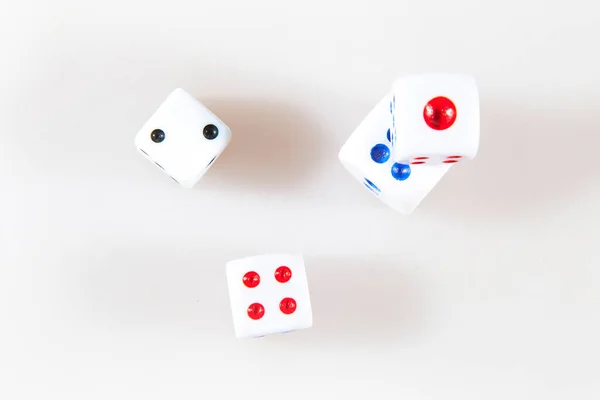 Casino dice on a white background. Games of chance. Top view