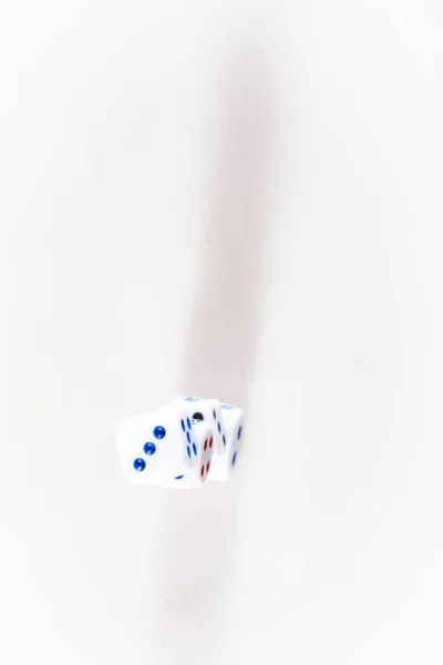 Casino dice on a white background. Games of chance. Top view