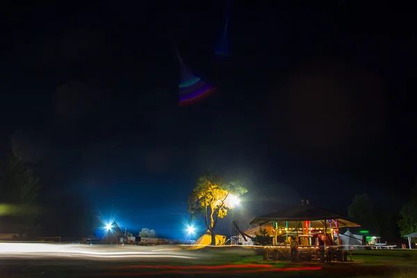 Tents in the tourist camp in a forest glade. Night. — Stock Photo, Image