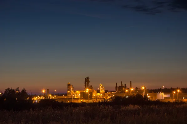 Night image of timber processing plant.