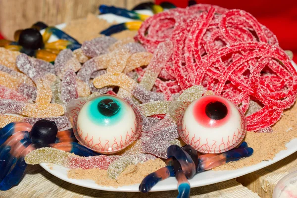 Sweets for Halloween on the holiday table. — Stock Photo, Image