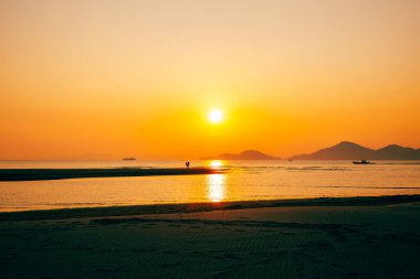 Busan, Kore 'deki Dadaepo plaj parkının gün batımı