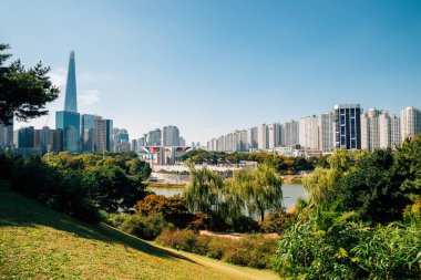 Seoul, Korea - October 6, 2020 : Olympic park green forest and Seoul cityscape