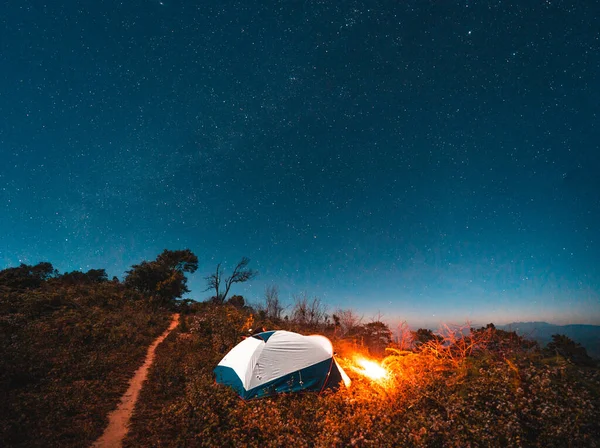 Camping tents and bonfires at night