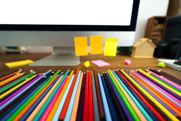 Colored pencils placed in front of the desk at home