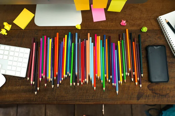 Colored pencils placed in front of the desk at home