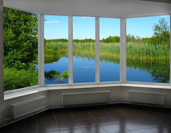 Modern window of veranda overlooking the river — Stock Photo, Image