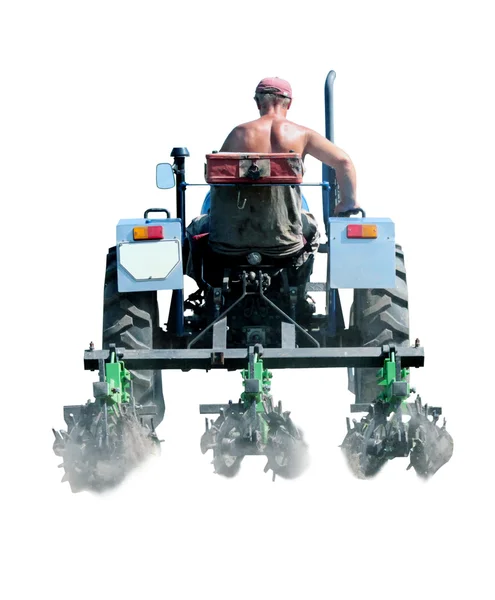 Man drives a tractor with special equipment isolated — Stock Photo, Image