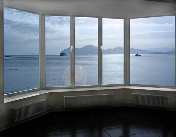 Panoramic window overlooking in ocean with ships. Domestic concept. Travel concept. Summer vacations. Ships in sea. Wide window with seascape. View from room. Marine panorama