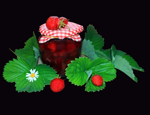 Jar with strawberry jam and green leaves on the black — Stock Photo, Image