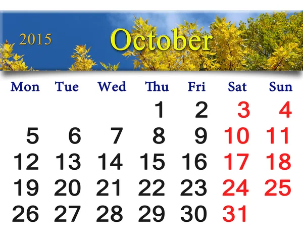 Calendar for October of 2015 with autumn leaves and sky — Stock Photo, Image