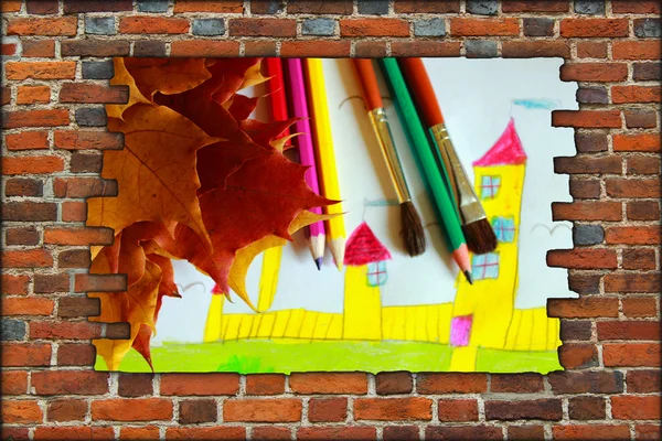 Brick wall and view children's drawing of house and leaves — Stock Photo, Image