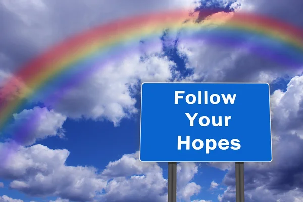 Billboard с надписью "Follow Your Hopes" — стоковое фото