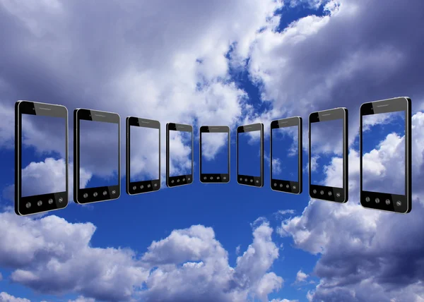 Smart-phones transparent på blå himmel bakgrund — Stockfoto