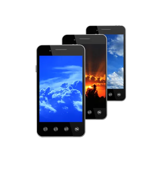 Smart-telefoons met foto van verschillende hemel — Stockfoto