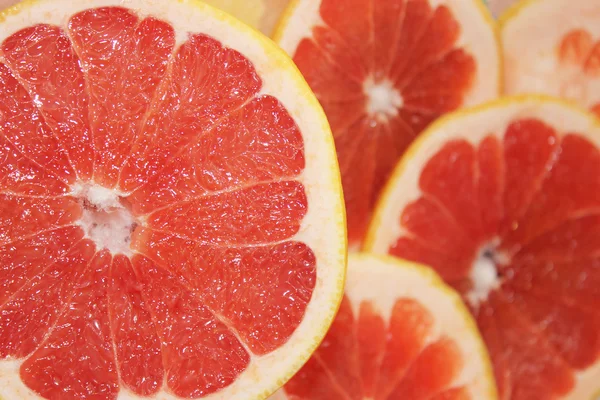 Grapefruits red cut by pieces — Stock Photo, Image