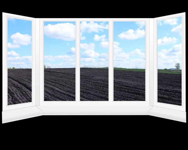 Windows overlooking plowed land ready for planting — Stock Photo, Image