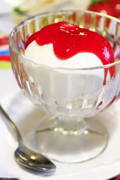 Ice cream poured raspberry syrup — Stock Photo, Image