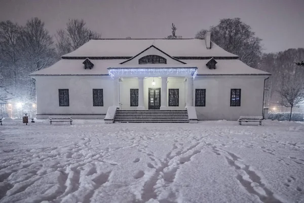 Fresh city snow in city park, winter, Poland, Cracow - Bialopradnicki Manor House