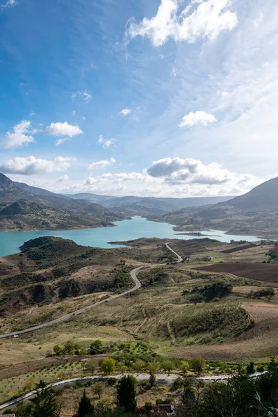 a landscape image windy roads and endless hills in Zahara de la Sierra