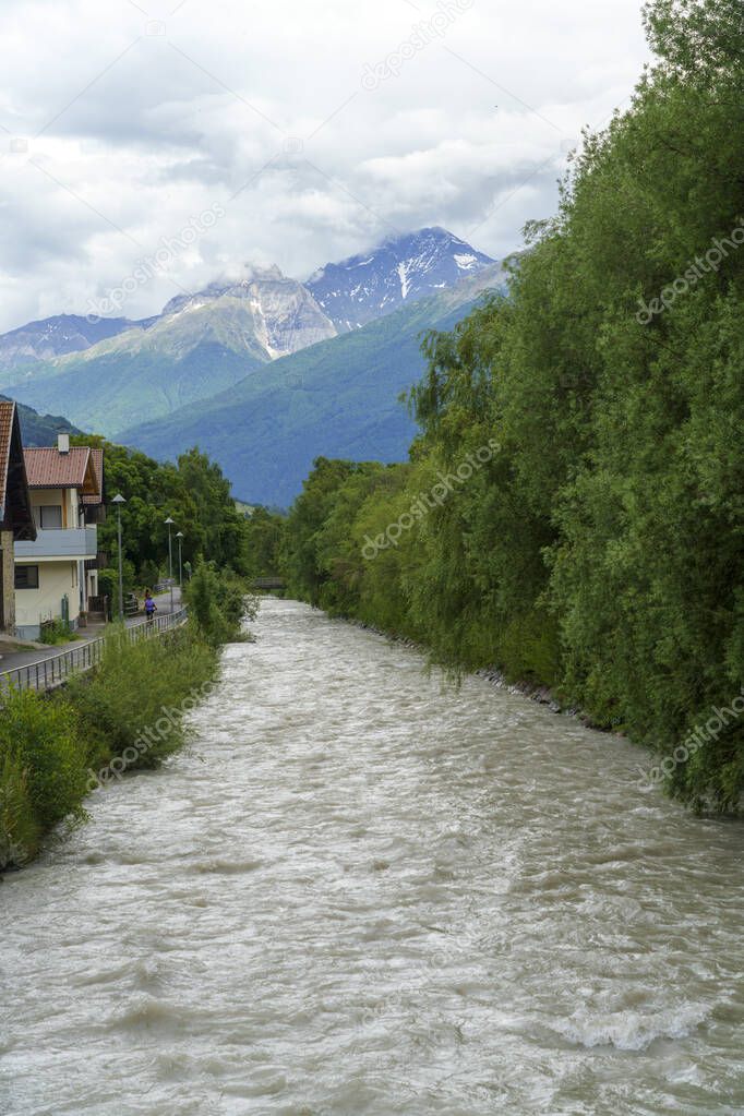 Summer landscape along the cycleway of the Venosta valley and the Adige river, in the Bolzano province, Trentino Alto Adige, Italy, at Glorenza