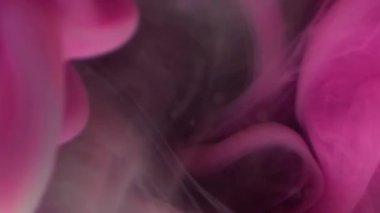 Bulut karışımı. Boyayla boyanmış. Pembe sıvı boya patlaması, mavi yeşil akış. Sanat dumanı dalgası soyut bulanık arkaplan renkli pigmentleri karıştırıyor.