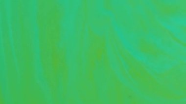 Mürekkebi karıştır. Soyut lekeler. Odaksız yeşil renkli sıçrama su sıvı emülsiyon parçacıkları akrilik sanat arka planında akıyor.