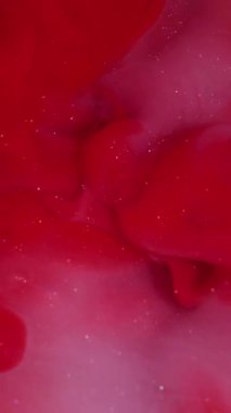 Vertical video. Fume swirl. Art cloud. Red pink color water shimmering whirl stream texture. Fantasy twist defocused abstract ink blend background.
