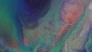 Bulanık boya sıçraması. Parlak sıvı. Odaklanmamış mavi turuncu renk parçacıkları soyut akrilik sanat arka planında yüzen sim dokusu.