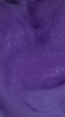 Vertical video. Galaxy paint. Dye spread. Fantasy cloud blending underwater. Violet color glitter pigment floating defocused stream background.