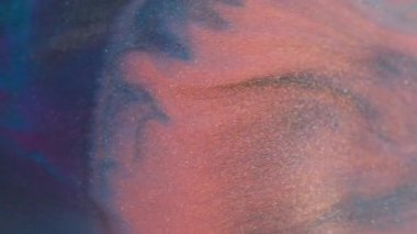 Bulanık boya sıçraması. Mermer dokusu. Odaklanmamış turuncu mavi renk parıltılı su parlak parçacıklar soyut arkaplanda yayılıyor.