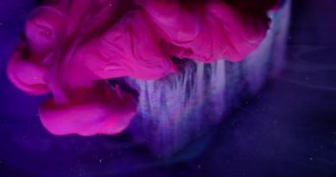 Dye spill. Blur paint wave. Sparkling pink violet smoke liquid pouring on art cube. Color water shimmering haze mix abstract background.