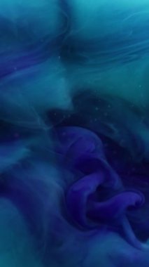 Dikey video. Dalga sisi. Sis boyası. Soyut sanat arka planında büyüyen çözünmüş mavi renkli sıvı karışımı girdap sıvısı karışımı sıçraması.