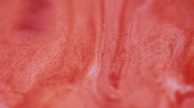 Tahıl mürekkebi. Akış sanatı. Odaklanmamış turuncu renkli mermer yüzey suyu sıvısı soyut kimyasal yaratıcı arka planda daireler çiziyor.