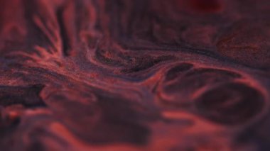 Boya dalgası. Parıltı karışımı. Su taneleri dokusunda çözünmüş turuncu mor renk soyut yaratıcı arka planda yüzen mermer sıvı..