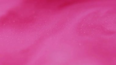 Akrilik mürekkep. Mermer dokusu. Parlak pigment emülsiyonunda çözünmüş pembe renk boyası soyut sanatında bulanık arkaplanda akıyor..