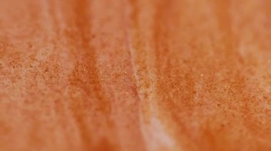 Pigmenti karıştır. Akış sanatı. Odaklanmamış turuncu renkli mermer yüzey suyu sıvısı soyut kimyasal yaratıcı arka planda daireler çiziyor.