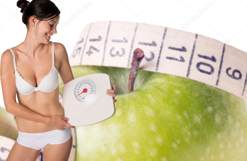 young woman with a weight scale