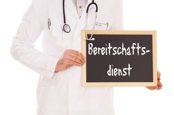 Doctor with shield and the german words Emergency Service — Stock Photo, Image