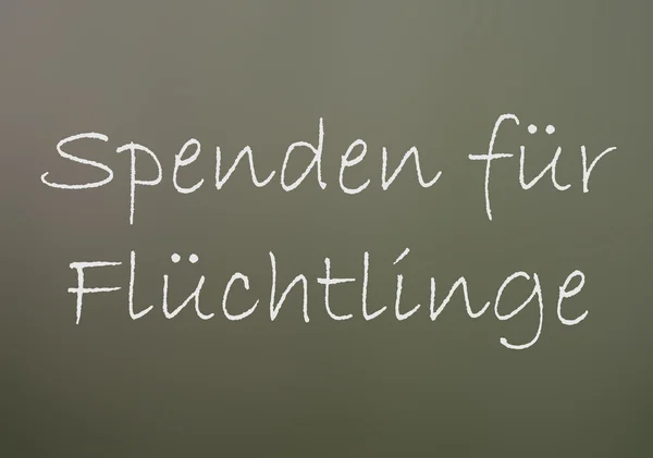 Крейда з німецькими словами Пожертвування для біженців — стокове фото