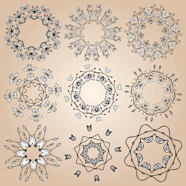 Rosettes ornementales ou flocons de neige — Image vectorielle