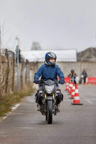 motorcycle driving school. a woman learns to drive before obtaining a driving license.